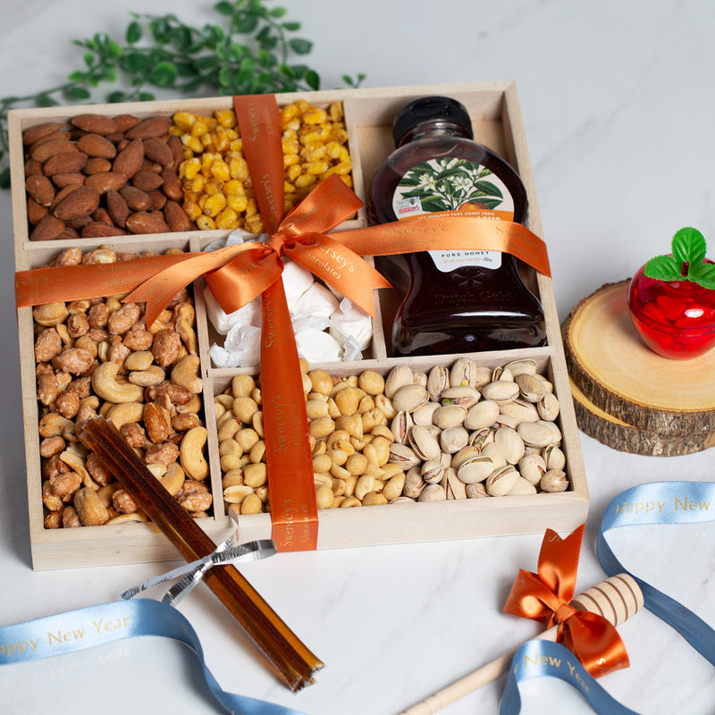 Rosh Hashanah Assorted Nuts & Honey Gift Box - Assorted Nuts, Honey and Honey sticks in a wooden box with orange ribbon.